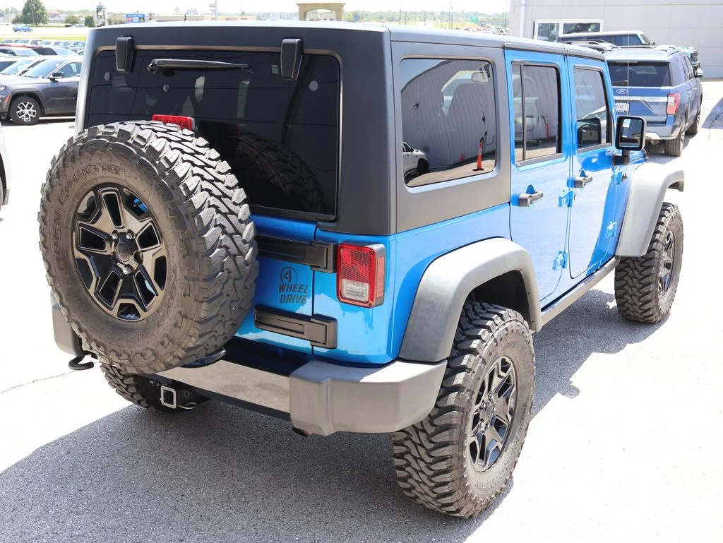 Used 2014 Blue Jeep Unlimited Sport image 5