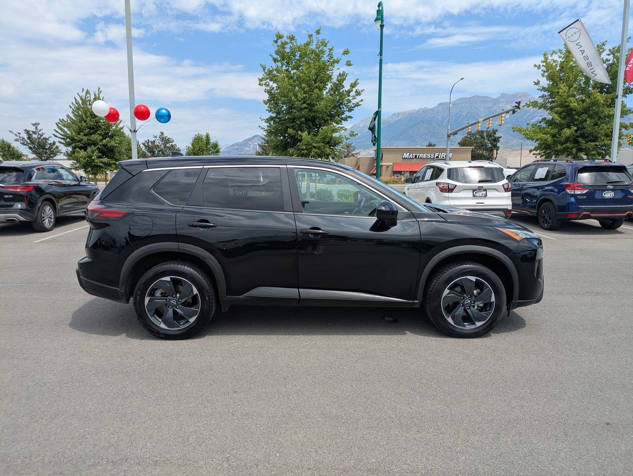 Used 2024 Super Black Nissan SV image 2