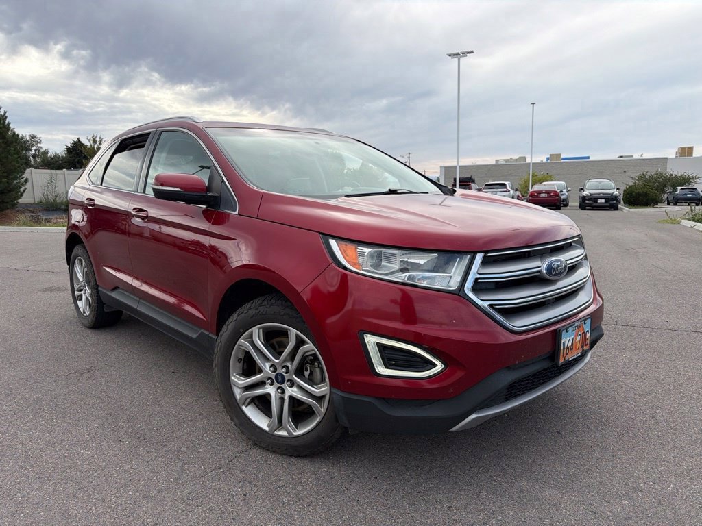 Used 2016 Ruby Red Metallic Ford Titanium image 1