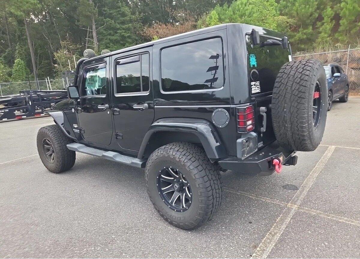 Used 2014 Black Clearcoat Jeep Sahara image 3