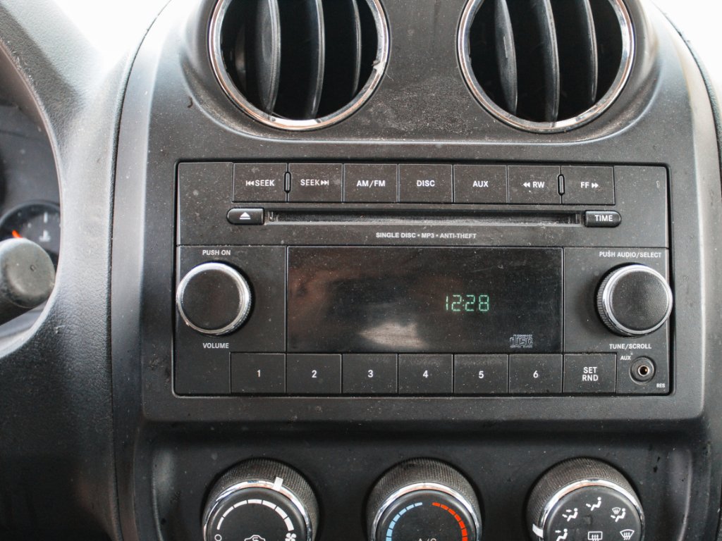Used 2012 Bright Silver Metallic Clearcoat Jeep Sport image 13