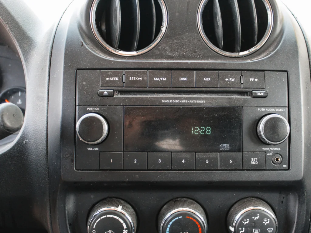 Used 2012 Bright Silver Metallic Clearcoat Jeep Sport image 13
