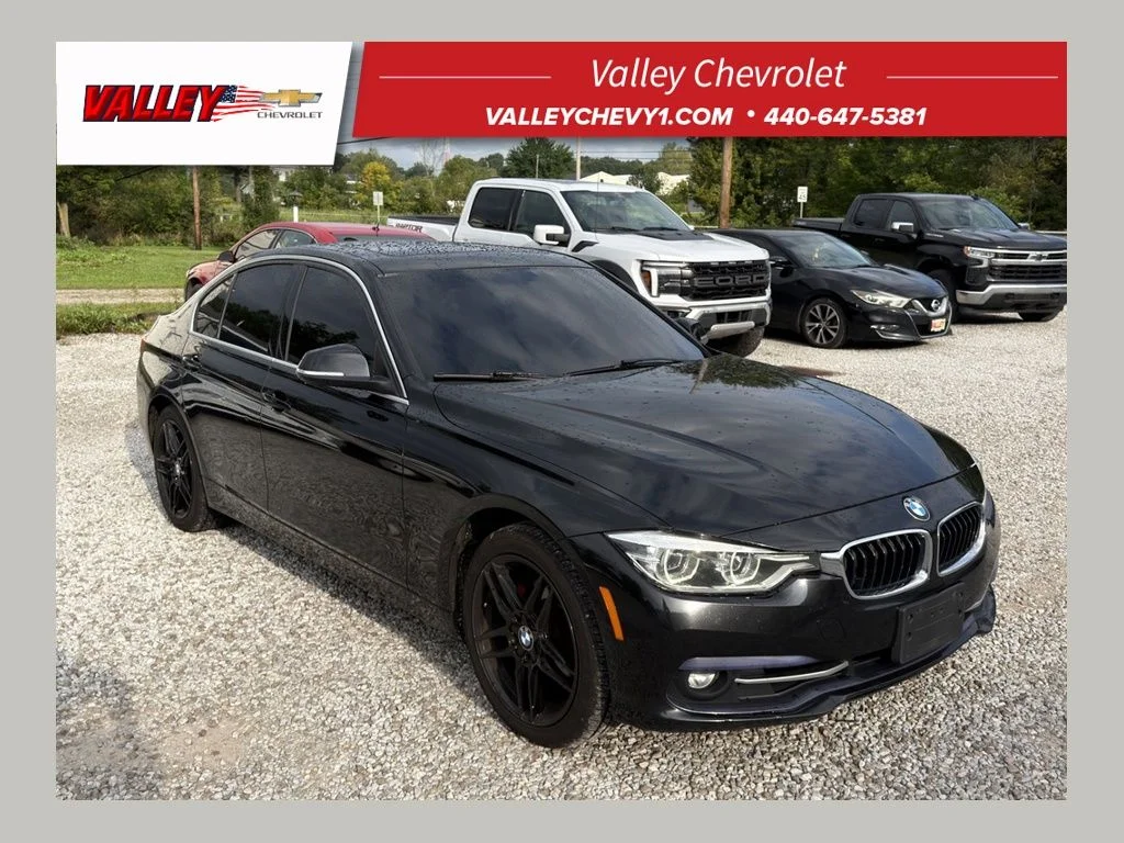 Used 2018 Black BMW 330i xDrive image 1