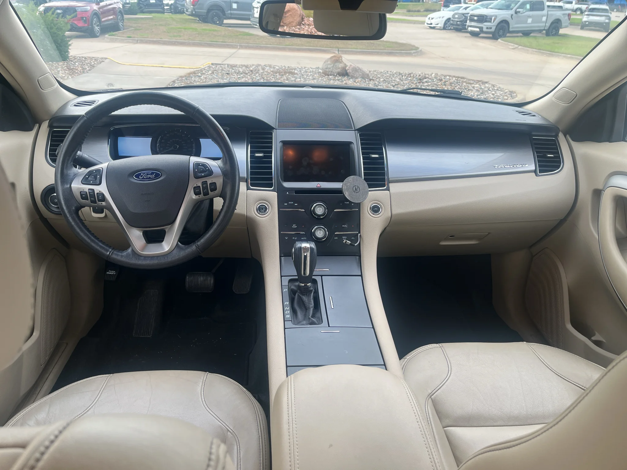 Used 2015 Ford Taurus SEL with VIN 1FAHP2E82FG101622 for sale in Pella, IA