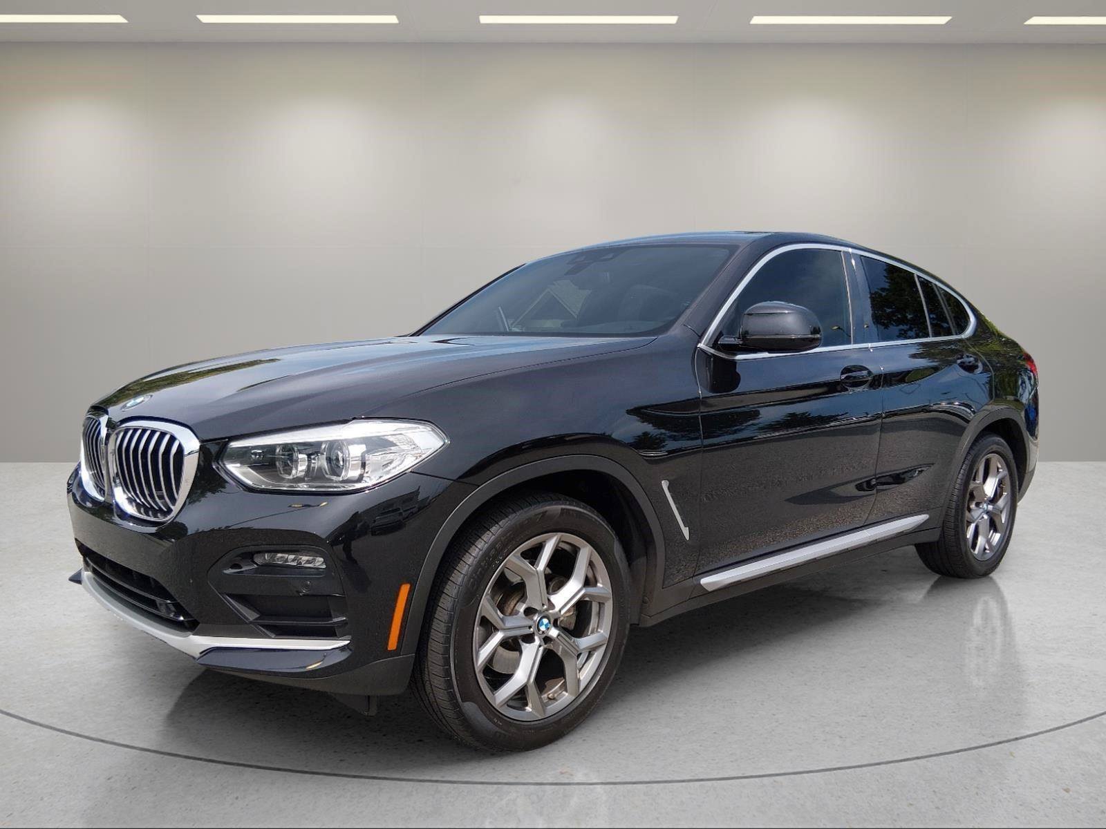 Used 2021 Black Sapphire Metallic BMW xDrive30i image 1