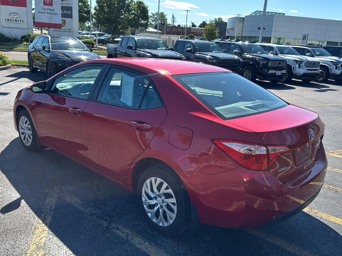 Used 2018 Barcelona Red Metallic Toyota LE image 4