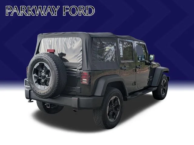 Used 2011 Green Jeep Unlimited Sport image 5