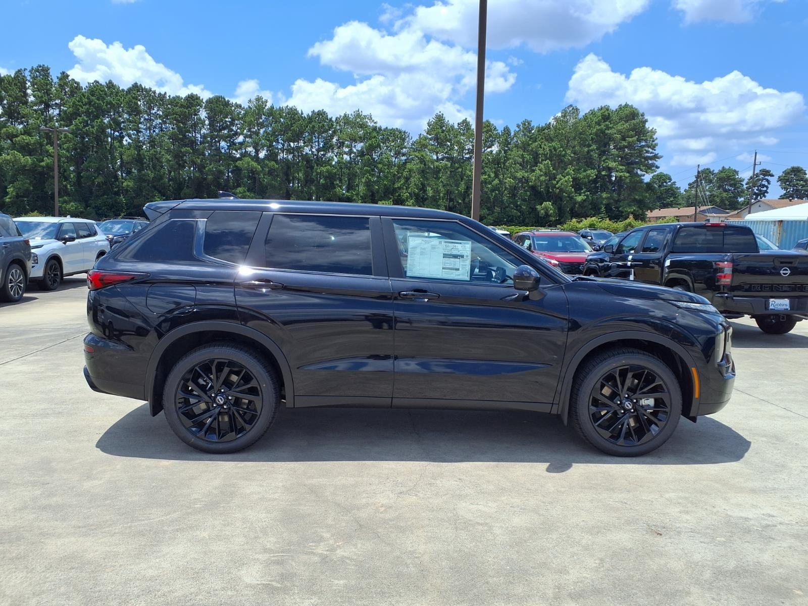 2026 Nissan Rogue Plug-In Hybrid SL Black at Sterling McCall Nissan