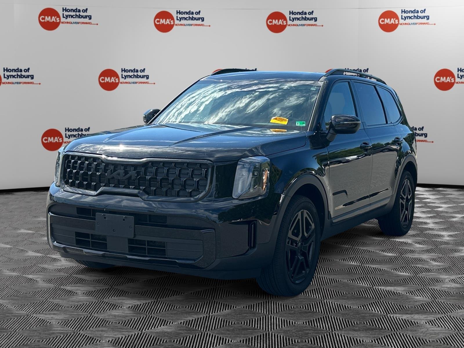 Used 2025 Ebony Black Kia EX X-Line image 1