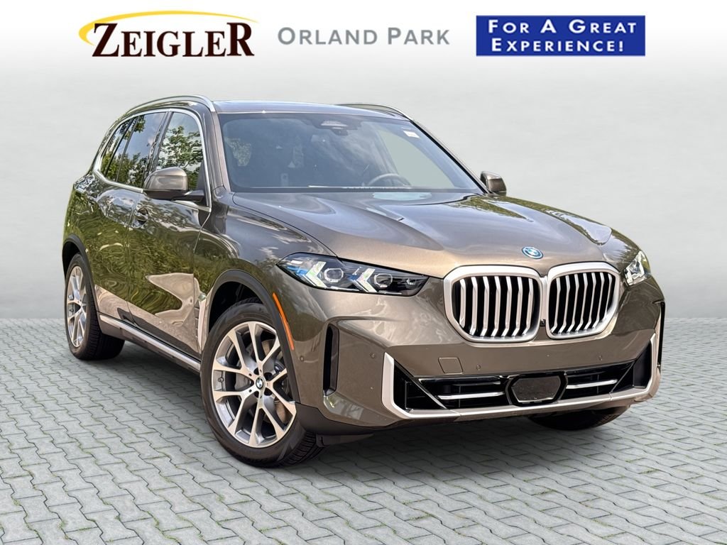 New 2026 Manhattan Green Metallic BMW xDrive50e image 1