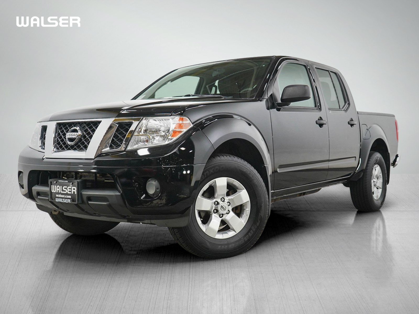 Used 2012 Super Black Metallic Nissan SV image 1