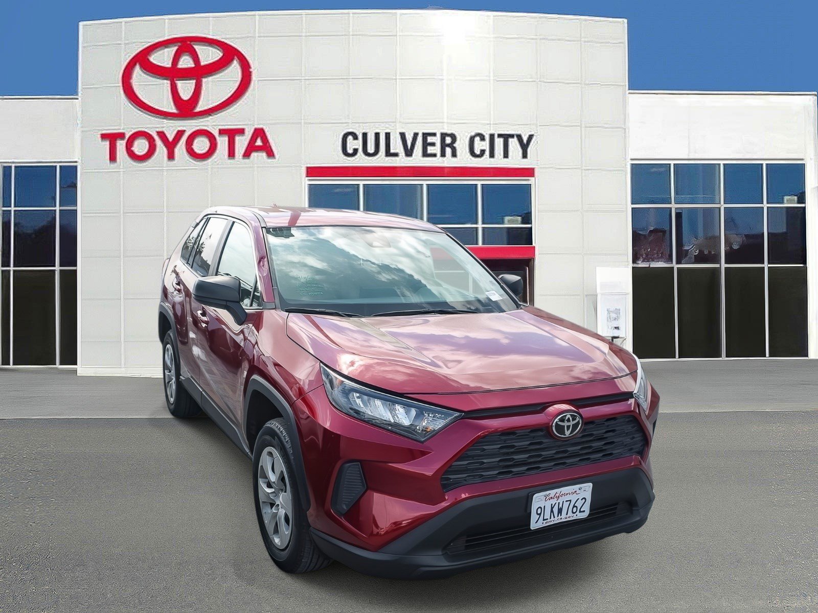 Certified Used 2022 Ruby Flare Pearl Toyota LE image 1