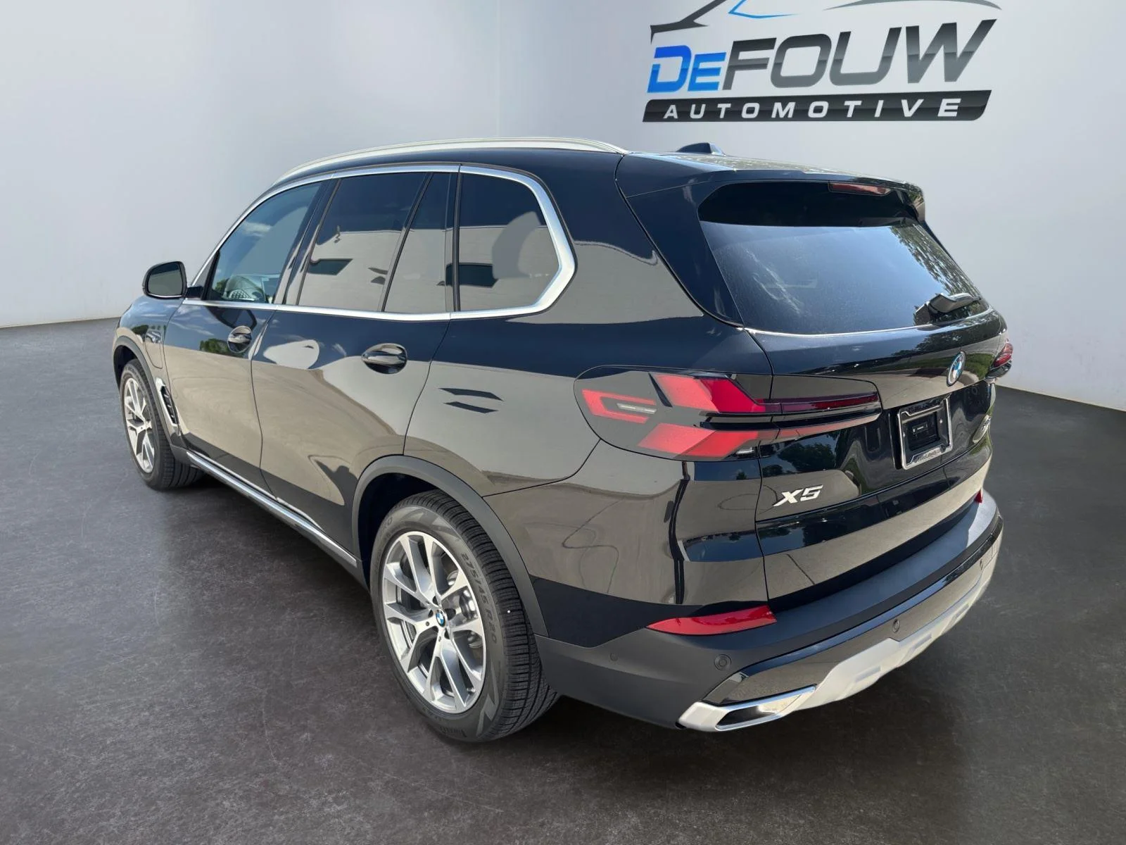 New 2026 Black Sapphire Metallic BMW xDrive50e image 17