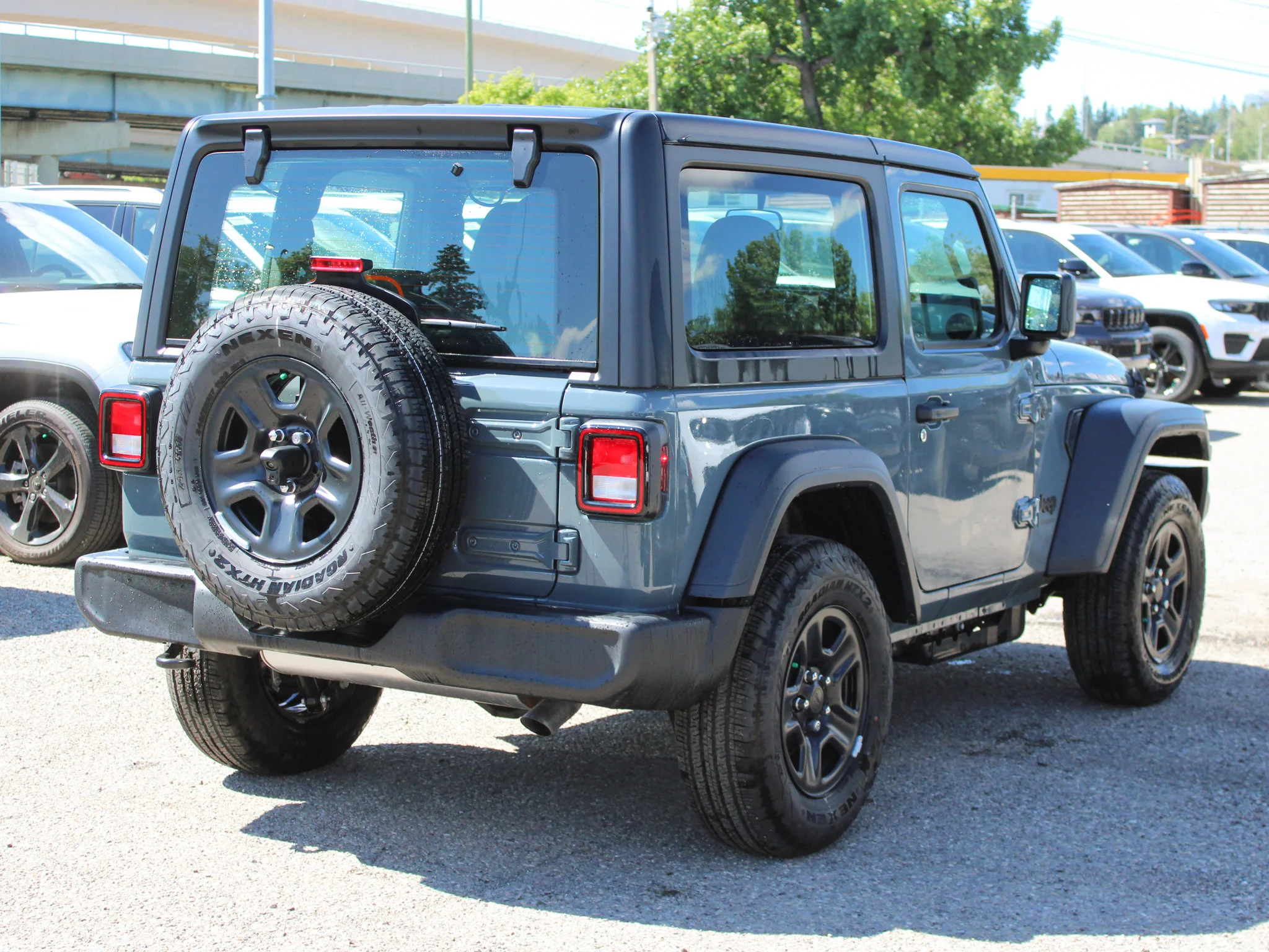 New 2026 Dark blue Jeep Sport* image 4