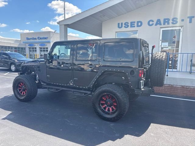Used 2013 Black Jeep Unlimited Sahara image 5