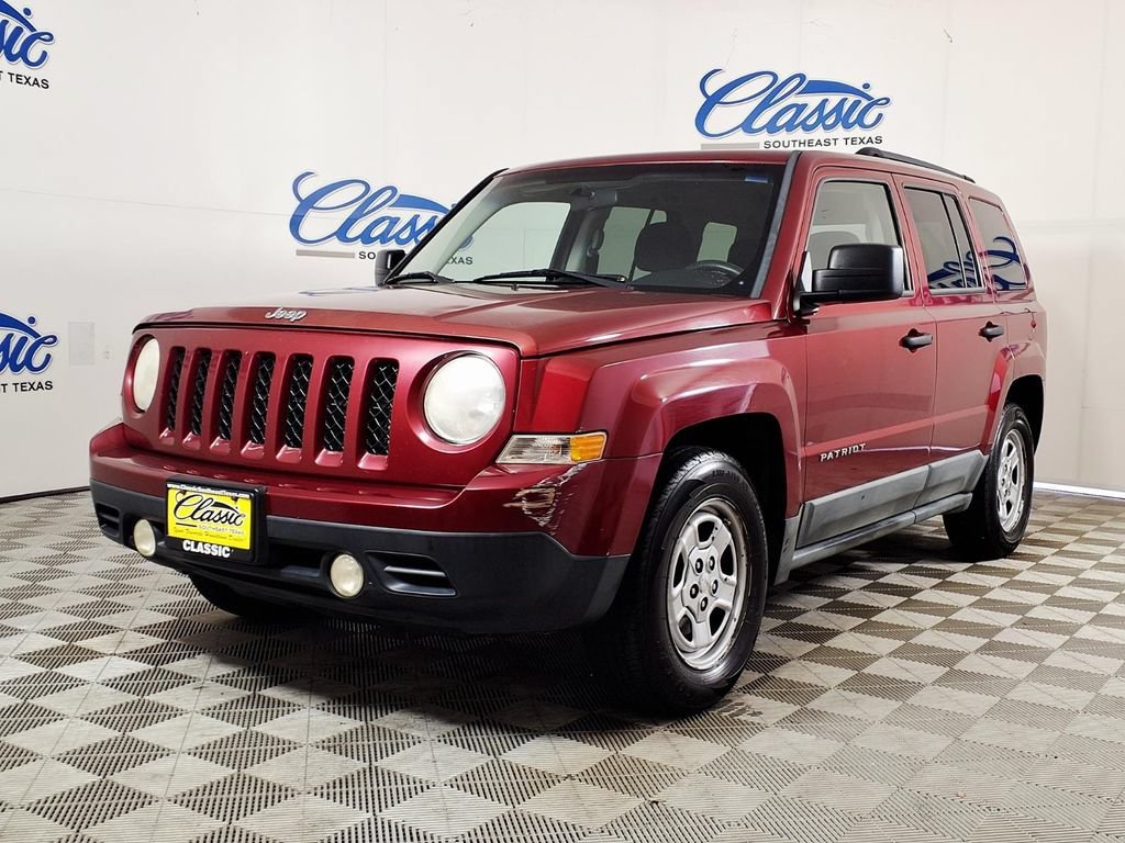 Used 2011 Deep Cherry Red Jeep Sport image 5