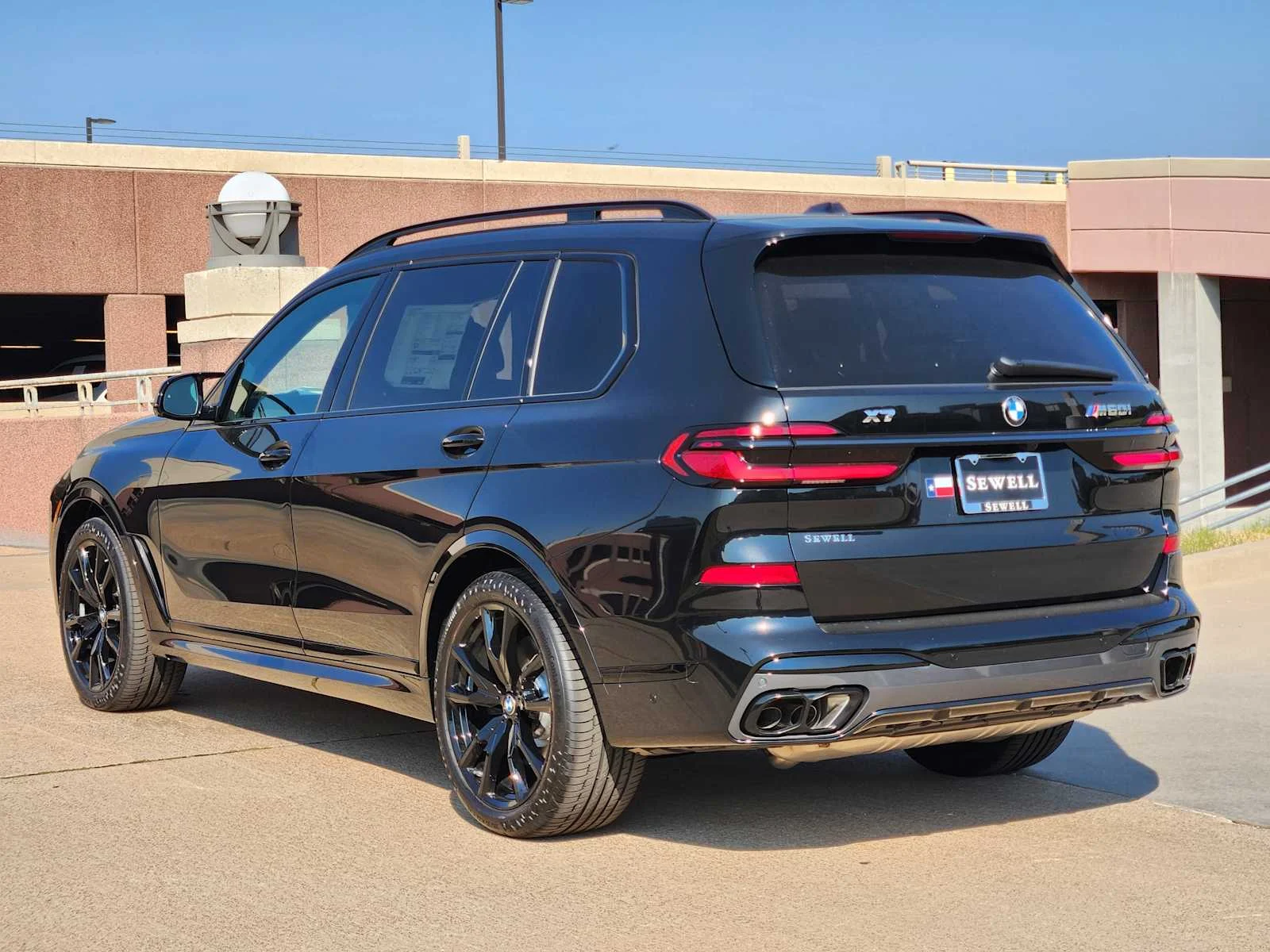 New 2027 Black Sapphire Metallic BMW M60i image 3