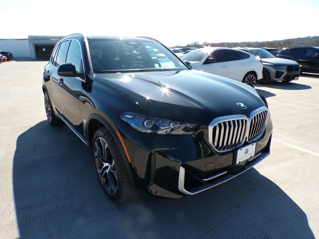 Certified Used 2026 Black Sapphire Metallic BMW xDrive40i image 1