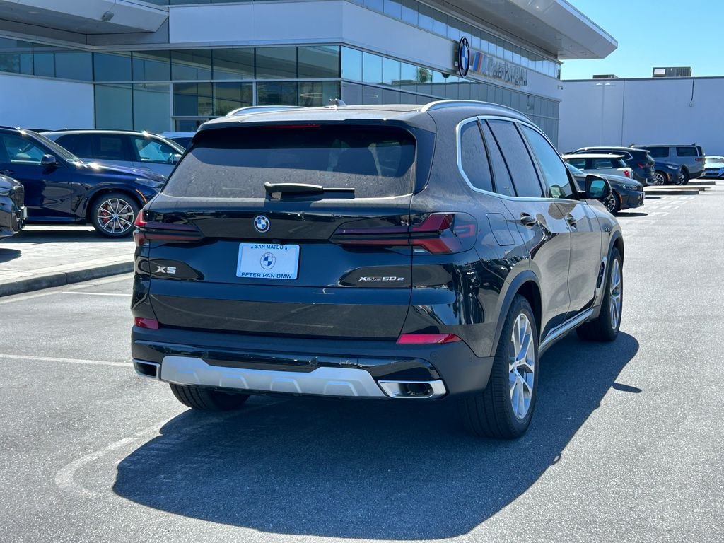 New 2026 Black Sapphire Metallic BMW xDrive50e image 5
