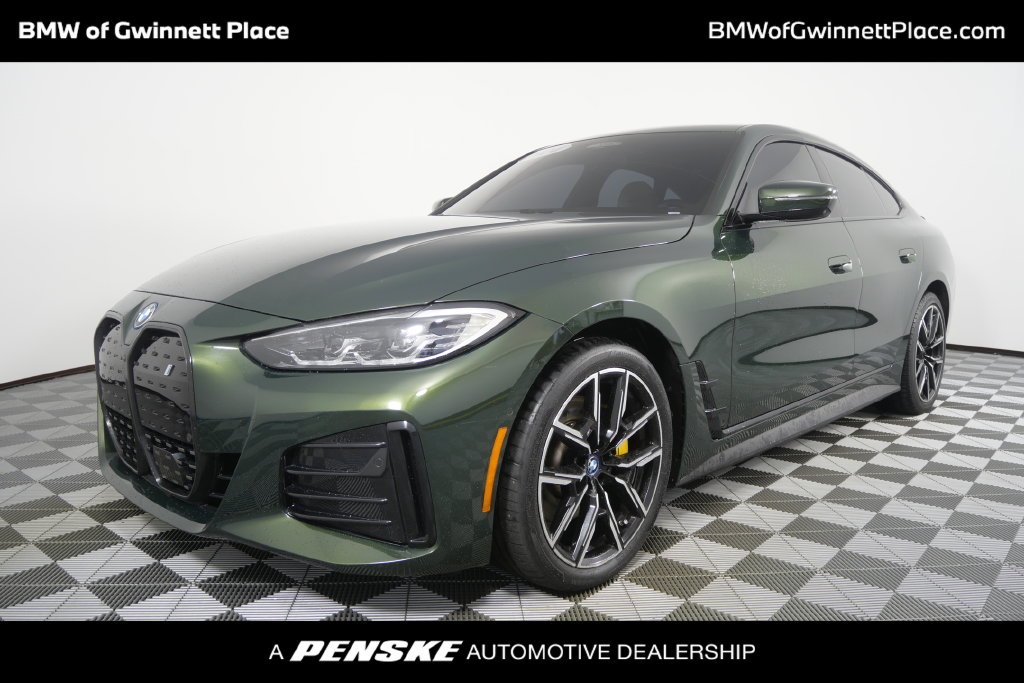 Certified Used 2024 Green Metallic BMW eDrive40 image 1
