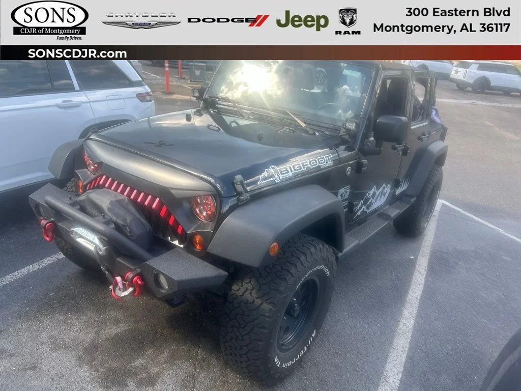 Used 2012 Black Jeep Sport image 1