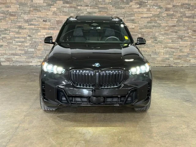 Used 2025 Black Sapphire Metallic BMW xDrive50e image 2