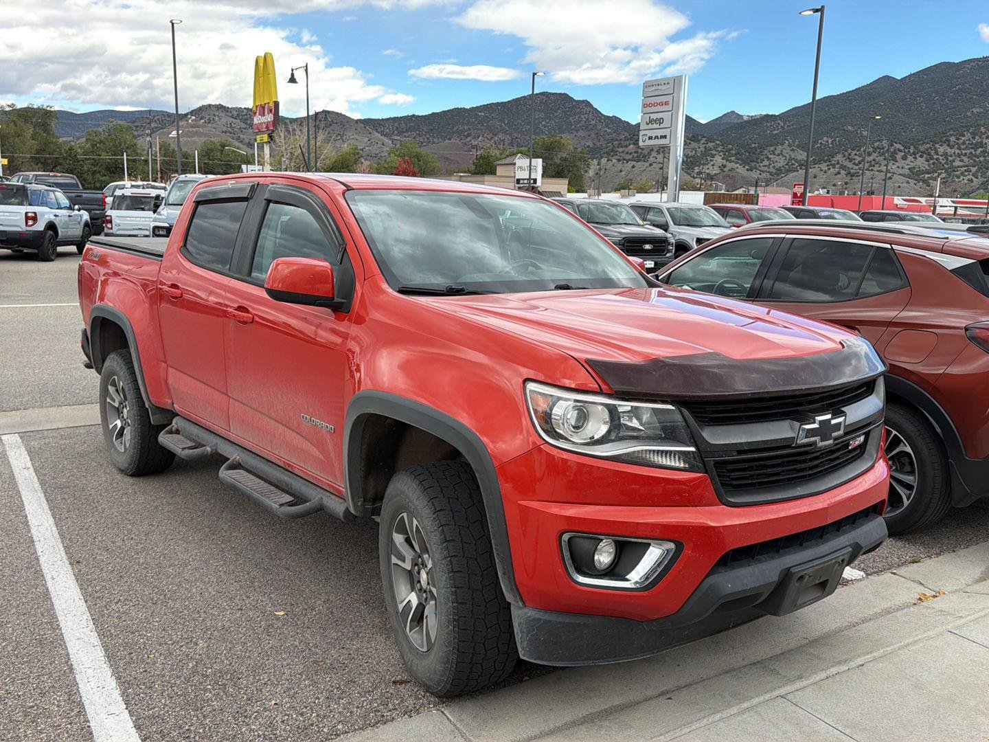 Used 2016 Inferno Orange Metallic Chevrolet 4WD Z71 image 2