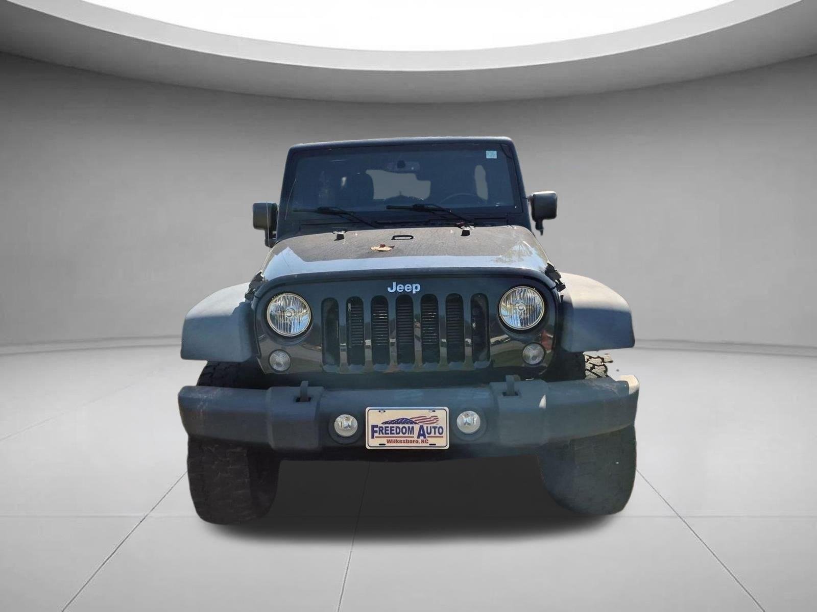 Used 2016 Black Clearcoat Jeep Sport image 2