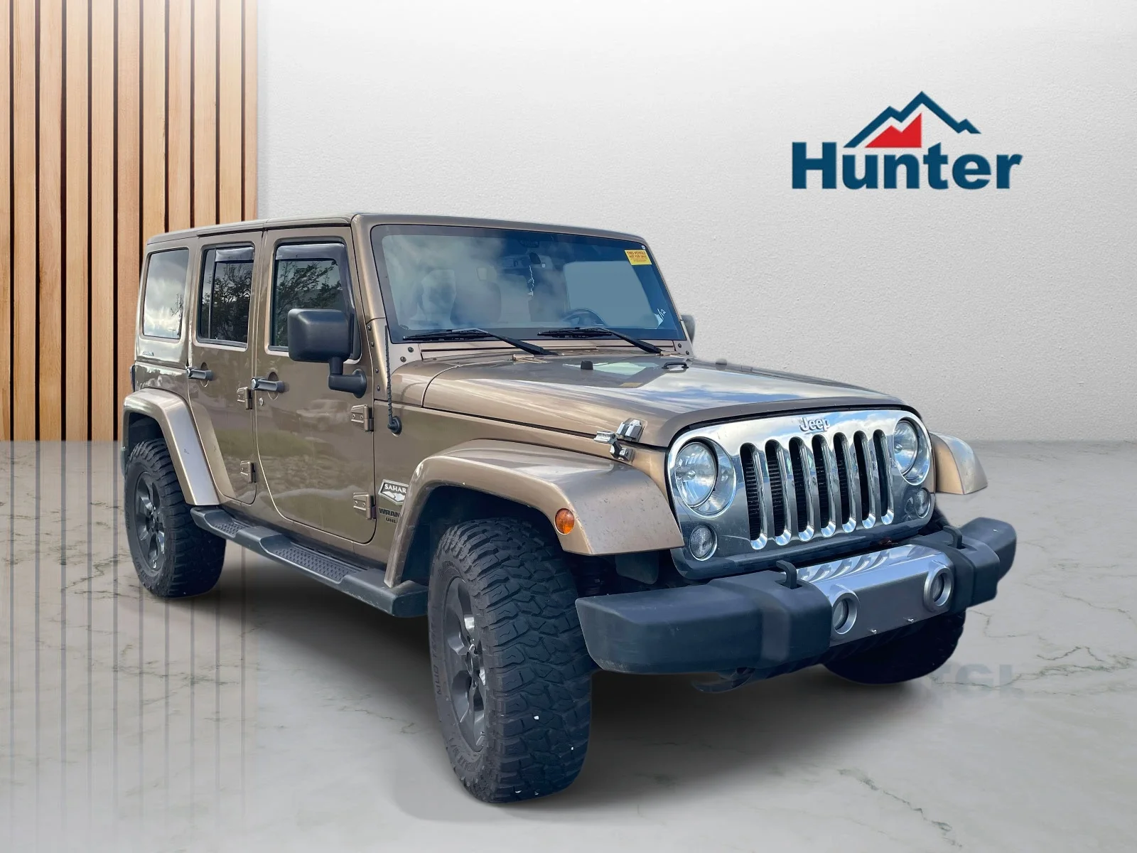 Used 2015 Copper Brown Pearlcoat Jeep Sahara image 1
