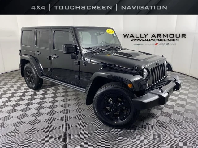 Used 2015 Black Jeep Unlimited Sahara image 1