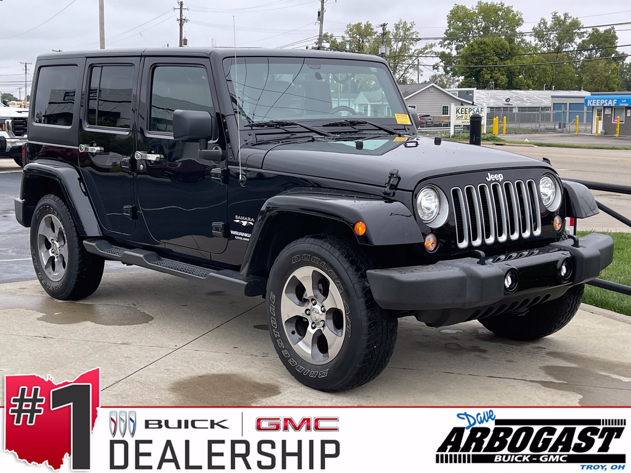Used 2017 Black Clearcoat Jeep Unlimited Sahara image 1