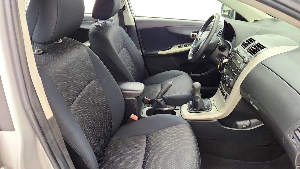 Used 2010 Classic Silver Metallic Toyota 4dr Sedan Manual S w/ Power Moonroof & 16