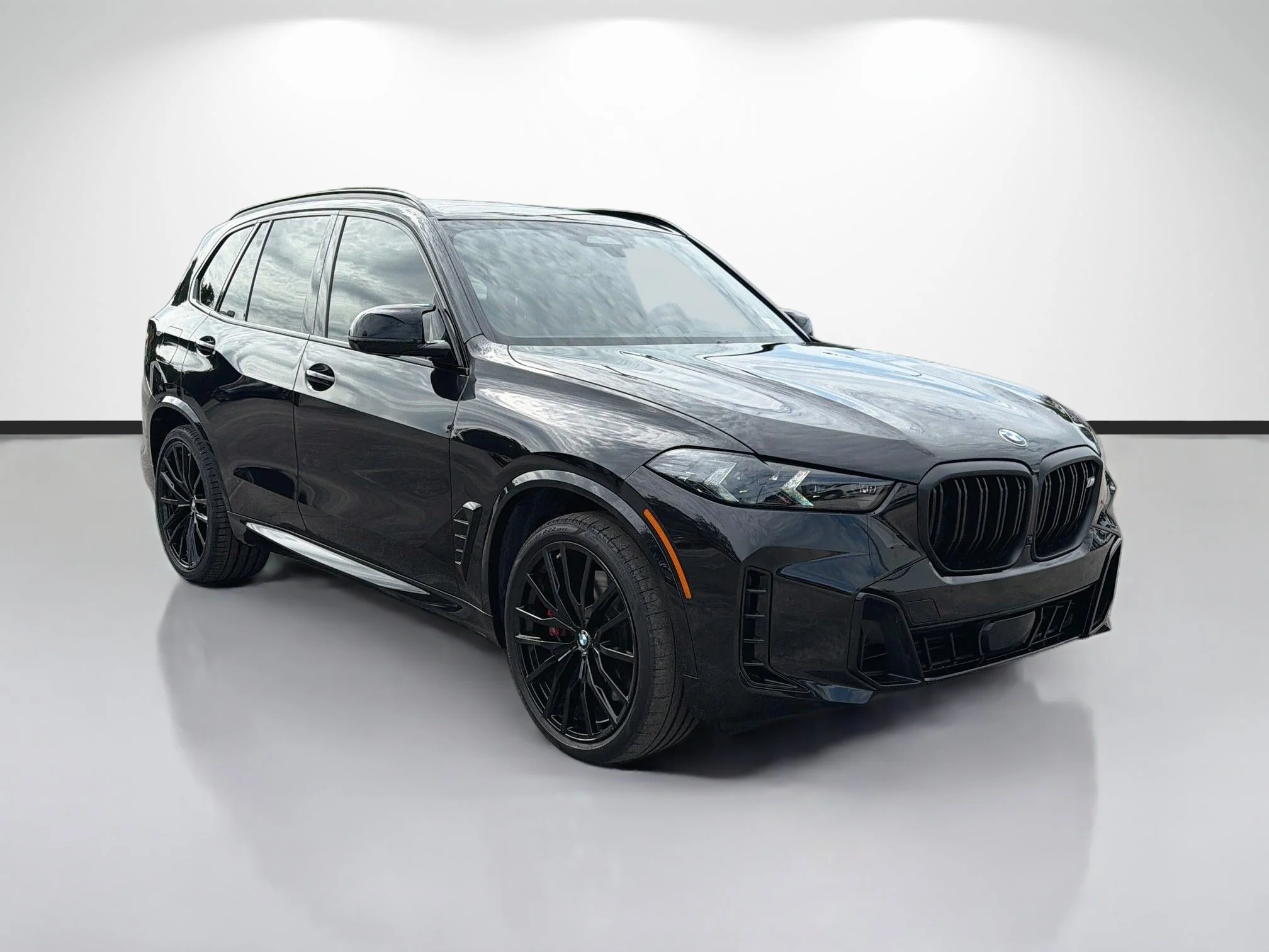Used 2025 Black Sapphire Metallic BMW M60i image 1
