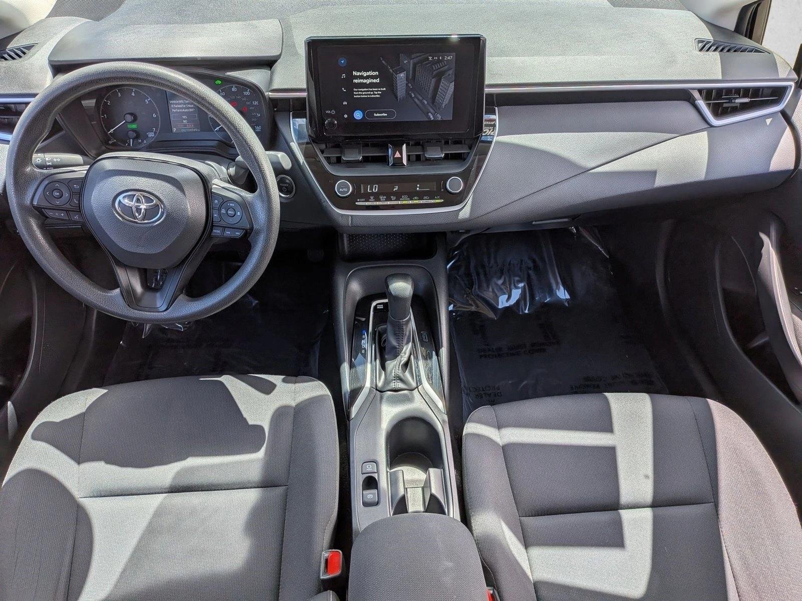Used 2024 Midnight Black Metallic Toyota Hybrid LE image 14