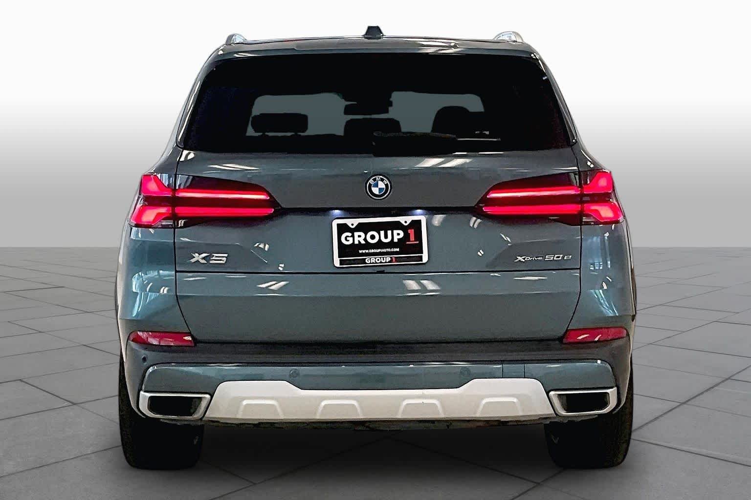 Used 2024 Blue Ridge Mountain Metallic BMW xDrive50e image 4