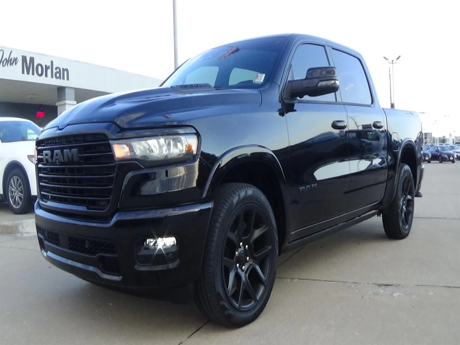 Used 2025 Diamond Black Crystal Pearl Coat (pxj) RAM Laramie image 2