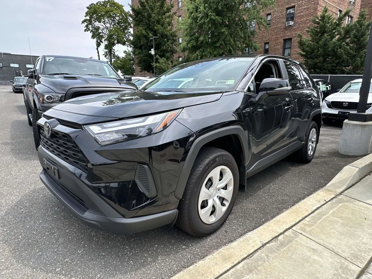 Used 2025 Midnight Black Metallic Toyota LE image 5