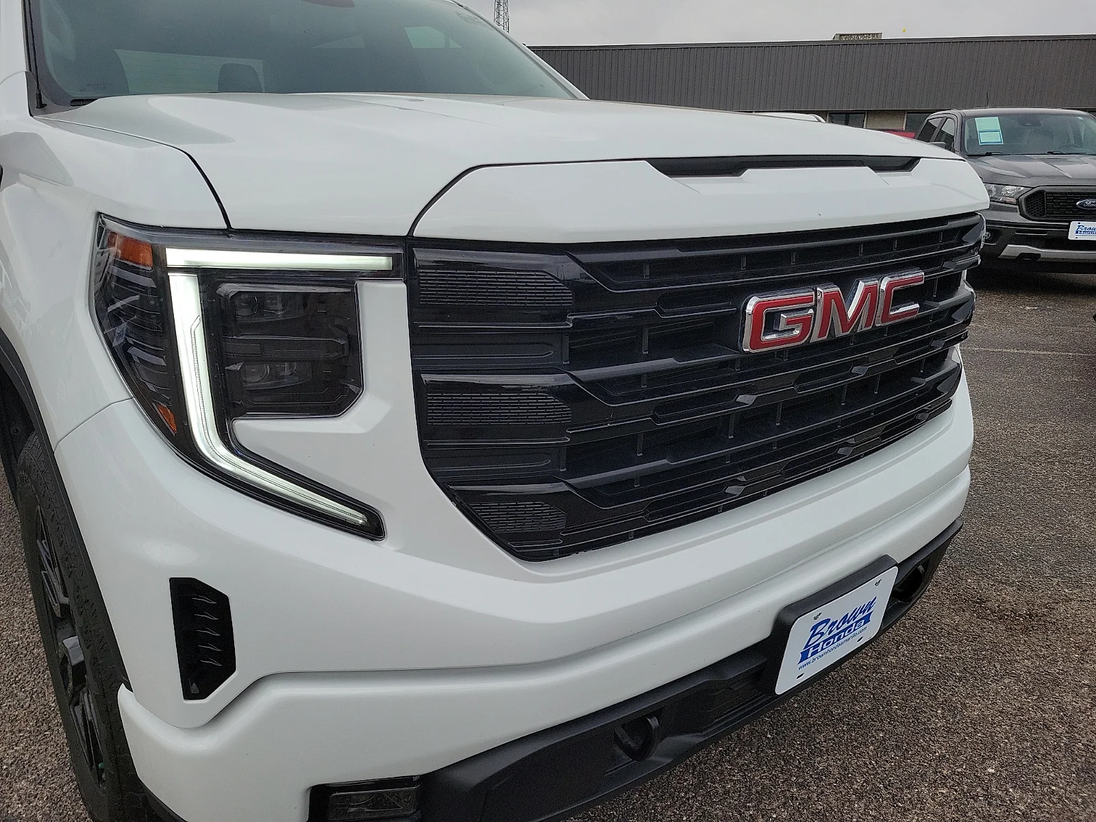 Certified Used 2024 Summit White GMC 4WD Crew Cab Short Box Elevation with 3SB image 13