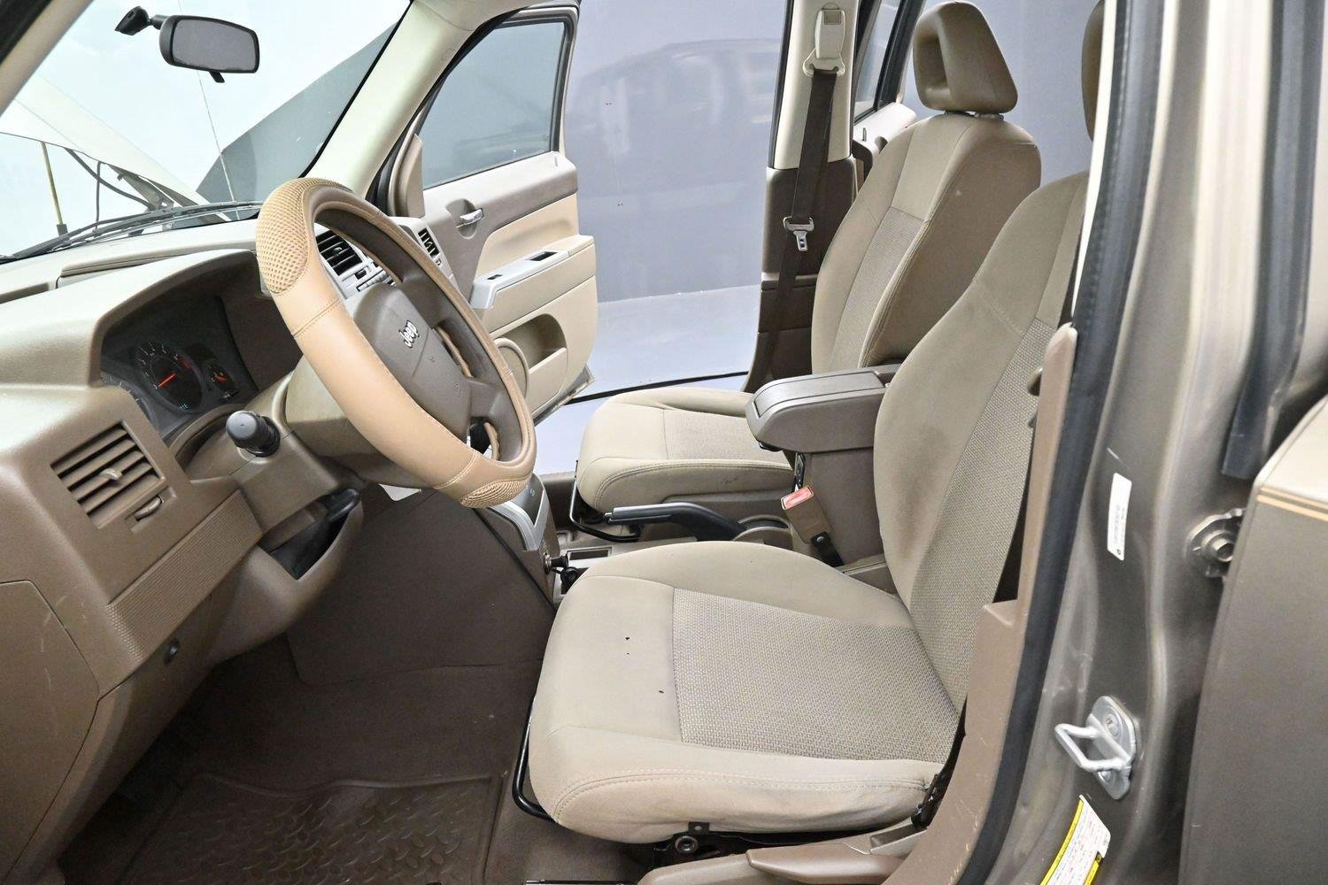 Used 2008 Light Khaki Metallic Jeep Sport image 12
