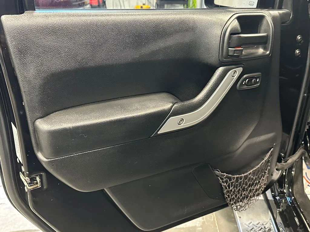 Used 2016 Black Jeep Unlimited Sahara image 12