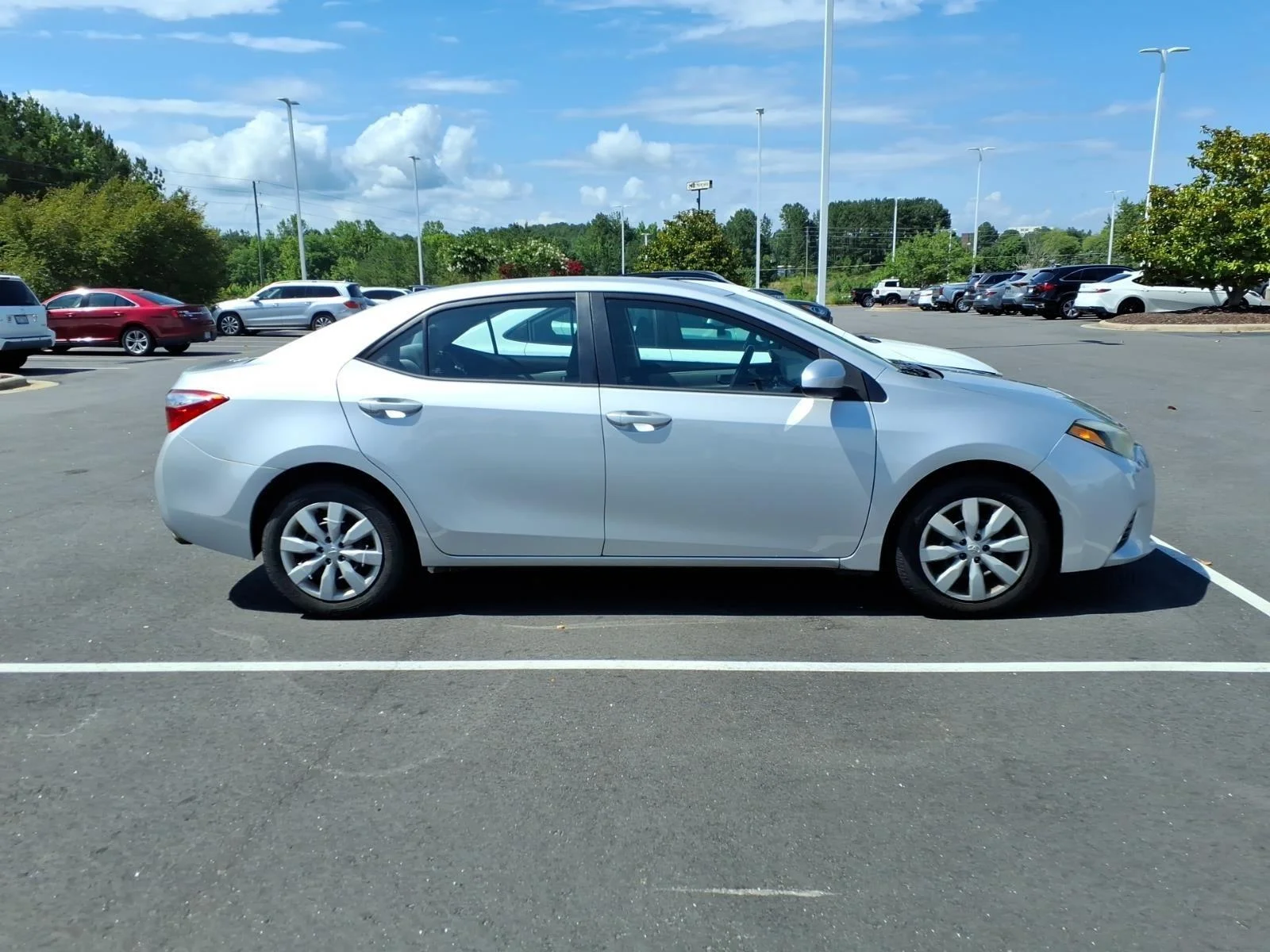 Used 2015 Classic Silver Metallic Toyota LE image 2