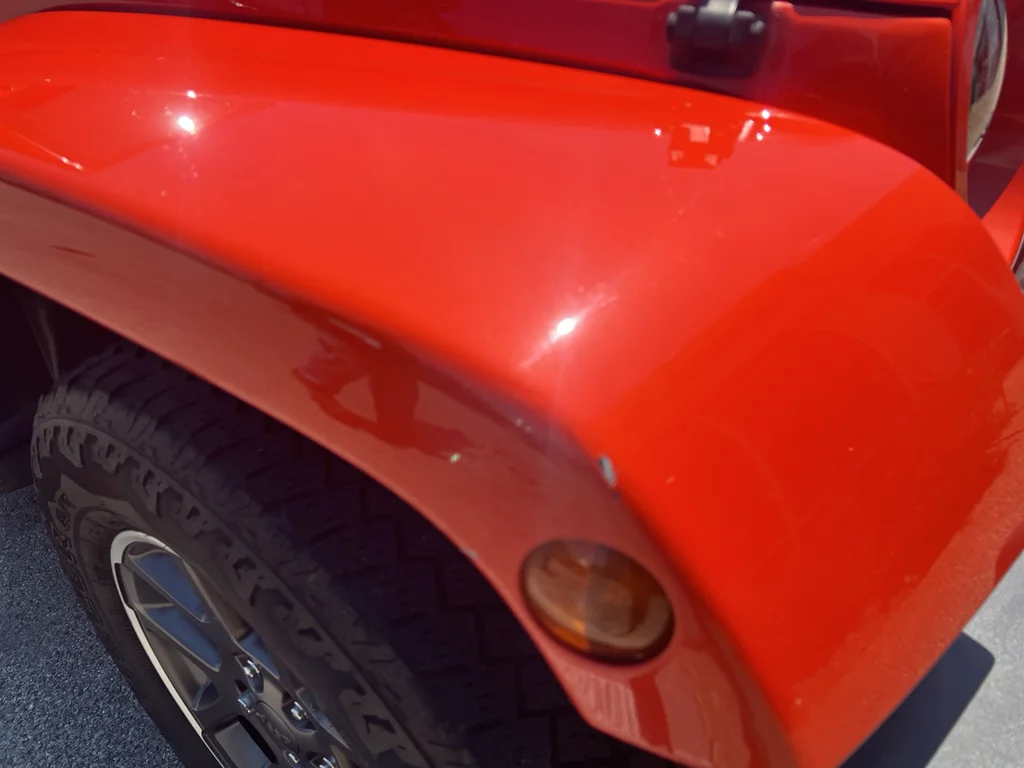 Used 2015 Sunset Orange Pearlcoat Jeep Sahara image 10