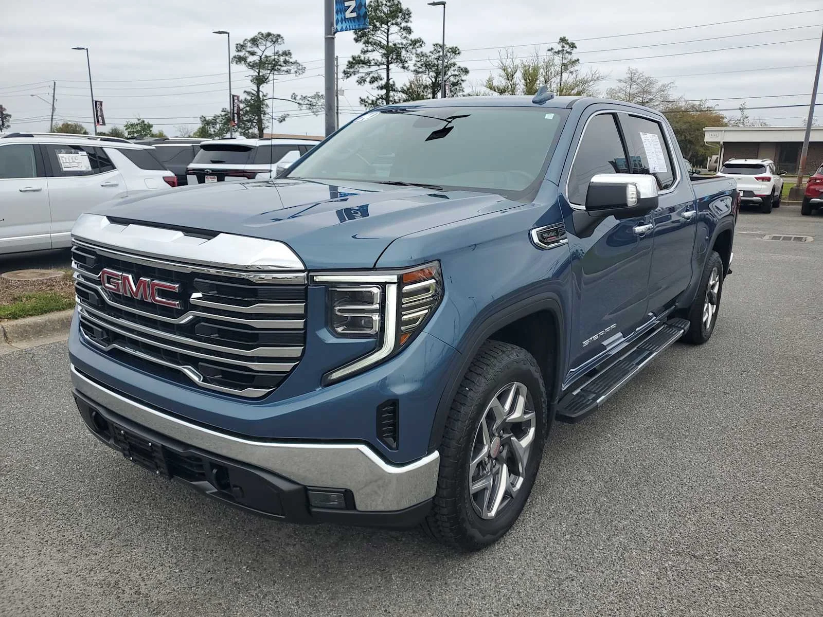 Used 2024 Downpour Metallic GMC SLT image 1