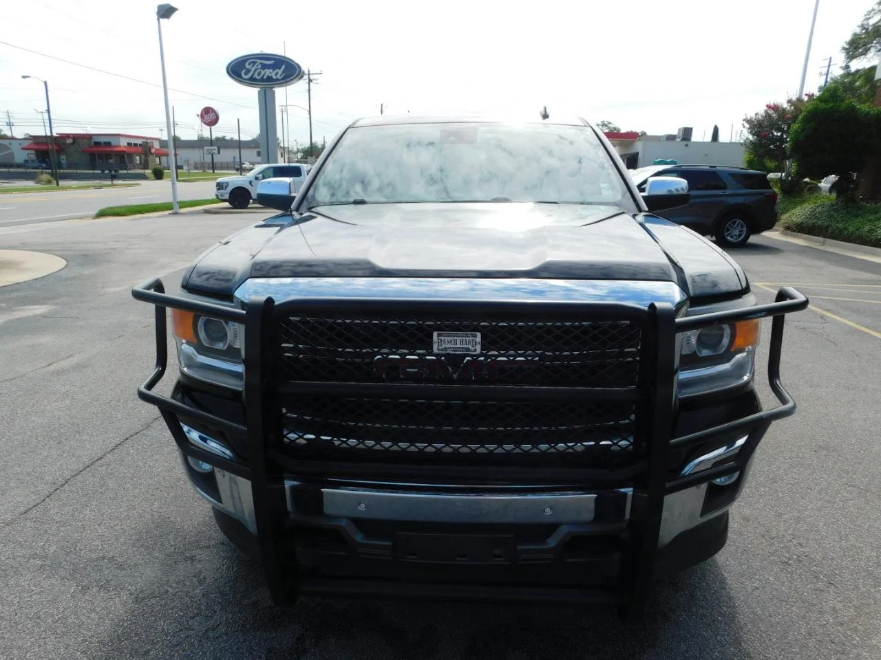 Used 2014 Black GMC 4WD Crew Cab 143.5 in SLT image 3
