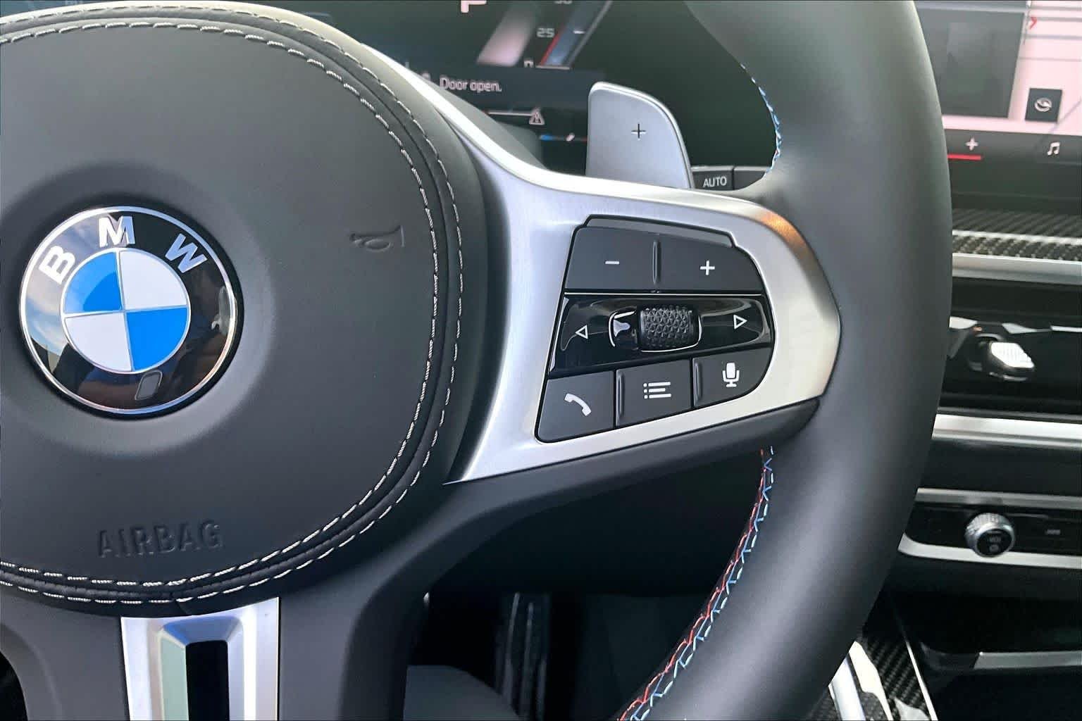 Used 2026 Black Sapphire Metallic BMW M60i image 21