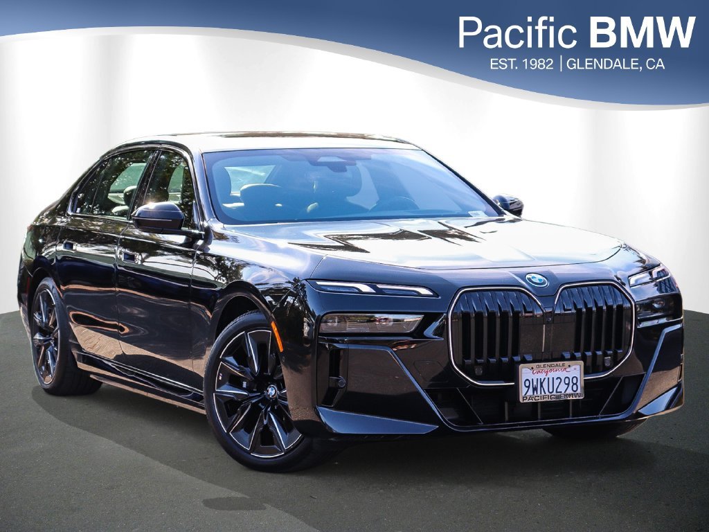 Used 2026 Black Sapphire Metallic BMW 750e xDrive image 1