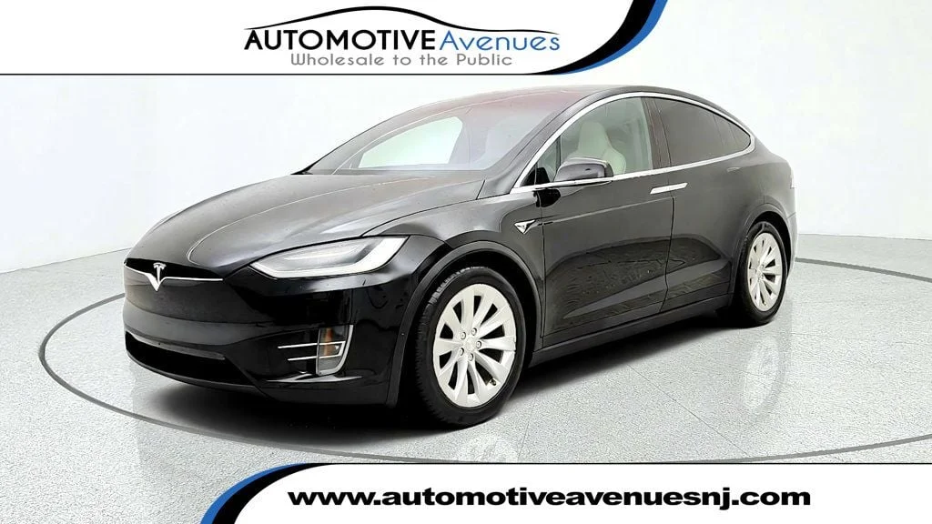 Used 2019 Solid Black Tesla Long Range AWD image 1