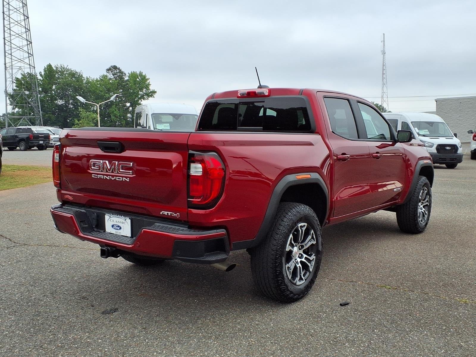 Used 2025 Volcanic Red Tintcoat GMC 4WD AT4 image 2