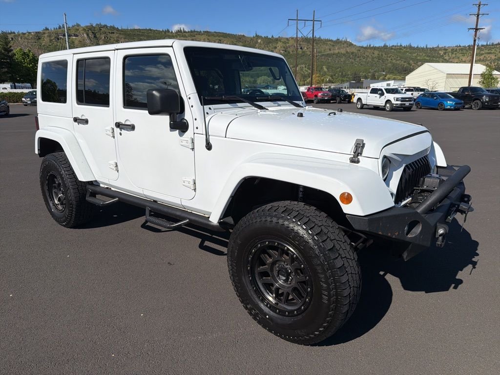 Used 2014 Jeep Wrangler Unlimited Sahara with VIN 1C4BJWEG1EL173868 for sale in The Dalles, OR