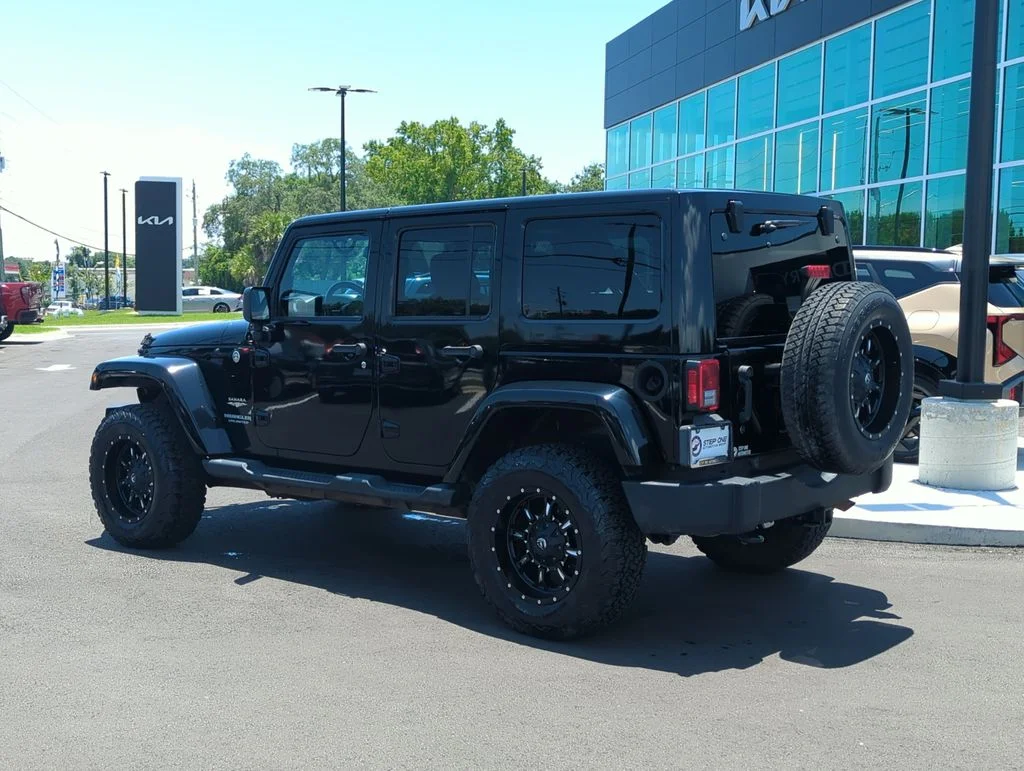 Used 2014 Black Jeep Unlimited Sahara image 5